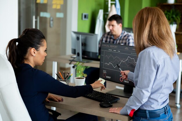 young-woman-using-laptop-office_1048944-14884868